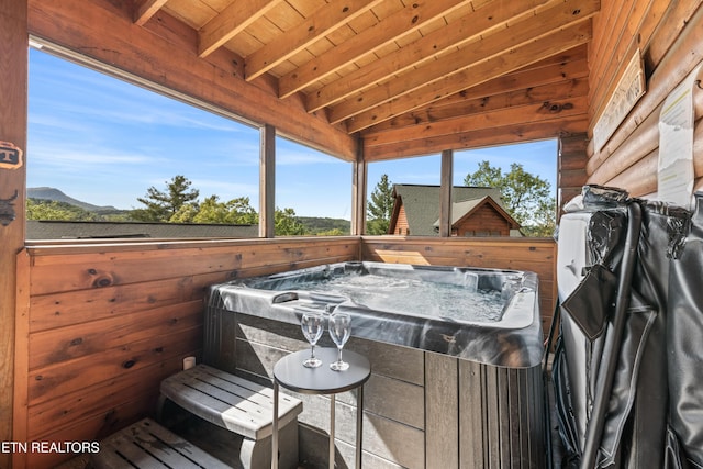 deck with a hot tub