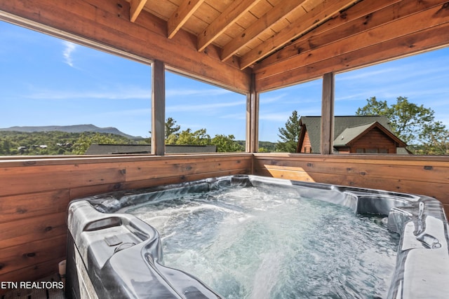 exterior view of a jacuzzi and a mountain view