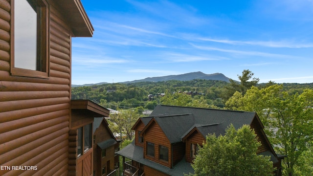 mountain view featuring a heavily wooded area
