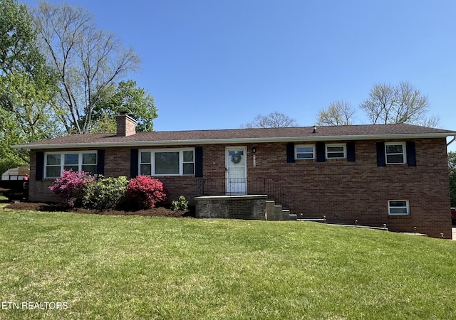 8008 Sharp Rd, Powell, TN 37849 - ranch-style home with a chimney, brick siding, and a front yard