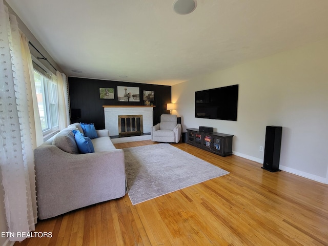 8008 Sharp Rd, Powell, TN 37849 - living area featuring baseboards, a brick fireplace, and wood finished floors