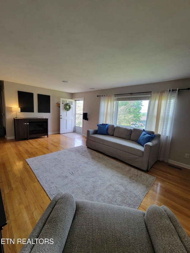 8008 Sharp Rd, Powell, TN 37849 - living area featuring baseboards and light wood finished floors