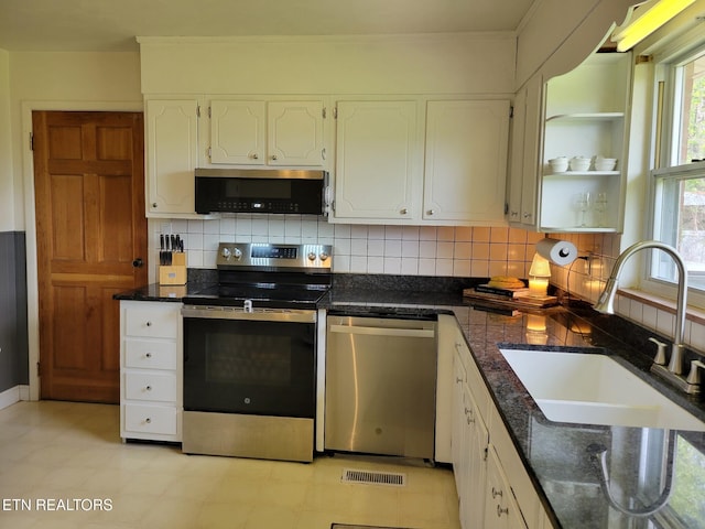 8008 Sharp Rd, Powell, TN 37849 - kitchen featuring white cabinetry, stainless steel appliances, tasteful backsplash, and a sink