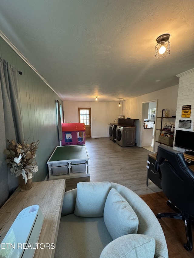 8008 Sharp Rd, Powell, TN 37849 - living area with independent washer and dryer, a textured ceiling, wood finished floors, and crown molding