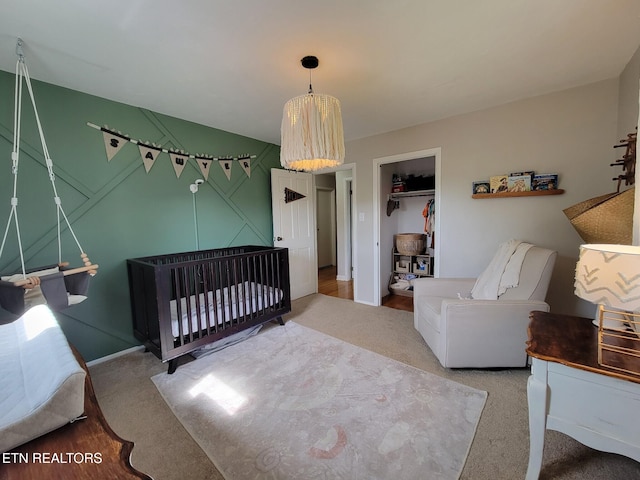 8008 Sharp Rd, Powell, TN 37849 - carpeted bedroom featuring a crib and baseboards