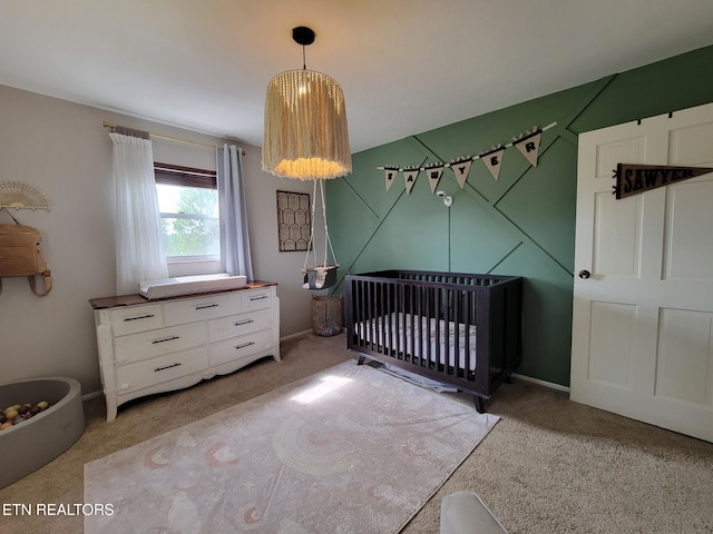 8008 Sharp Rd, Powell, TN 37849 - bedroom with a crib, light carpet, and baseboards