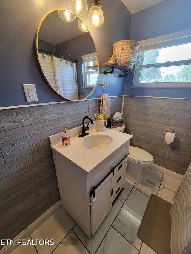 8008 Sharp Rd, Powell, TN 37849 - bathroom with toilet, marble finish floor, wainscoting, wooden walls, and vanity
