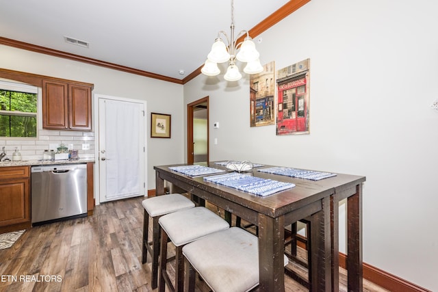 229 Bishops Cap Cir Unit 106, Townsend, TN 37882 - dining room featuring a chandelier, dark wood-type flooring, ornamental molding, and baseboards