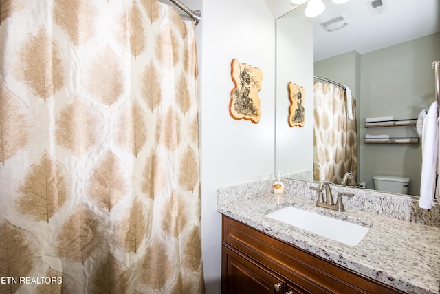 229 Bishops Cap Cir Unit 106, Townsend, TN 37882 - bathroom featuring vanity, a shower with shower curtain, and toilet