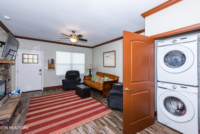 229 Bishops Cap Cir Unit 106, Townsend, TN 37882 - washroom with stacked washer and clothes dryer, wood finished floors, crown molding, a ceiling fan, and a fireplace