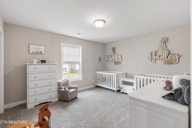 bedroom with light carpet and baseboards