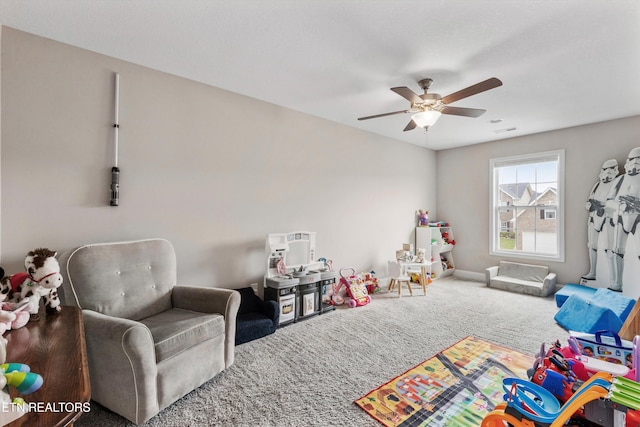 playroom with carpet and a ceiling fan