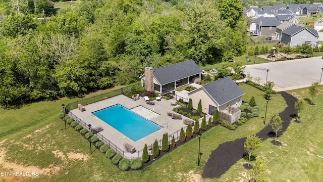 aerial perspective of suburban area with a pool area