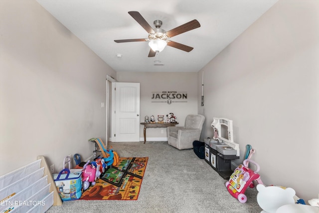 game room with carpet floors and a ceiling fan