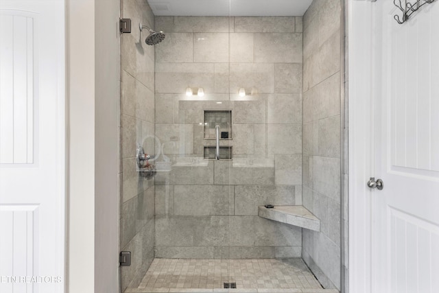 full bath with a shower stall