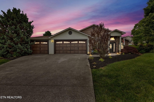 791 Constitution Dr, Jefferson City, TN 37760 - ranch-style house featuring a garage, concrete driveway, a front lawn, and stucco siding