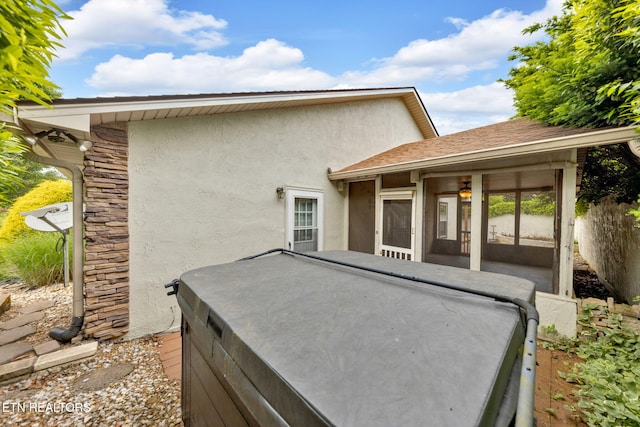 791 Constitution Dr, Jefferson City, TN 37760 - back of house with a hot tub, stucco siding, and stone siding