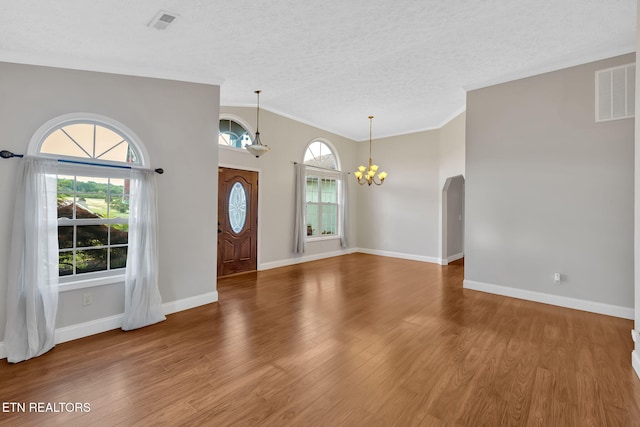 791 Constitution Dr, Jefferson City, TN 37760 - foyer featuring a chandelier, crown molding, wood finished floors, a textured ceiling, and baseboards