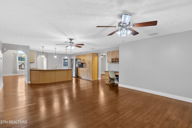791 Constitution Dr, Jefferson City, TN 37760 - unfurnished living room with a textured ceiling, a ceiling fan, baseboards, and dark wood-type flooring