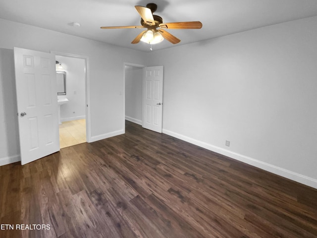 unfurnished bedroom with baseboards, dark wood-style floors, and ceiling fan