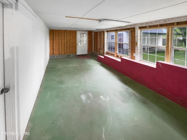 unfurnished room featuring finished concrete floors