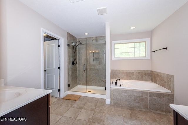 3336 Beaver Glade Ln, Knoxville, TN 37931 - full bath featuring vanity, a shower stall, tile patterned flooring, a bath, and recessed lighting