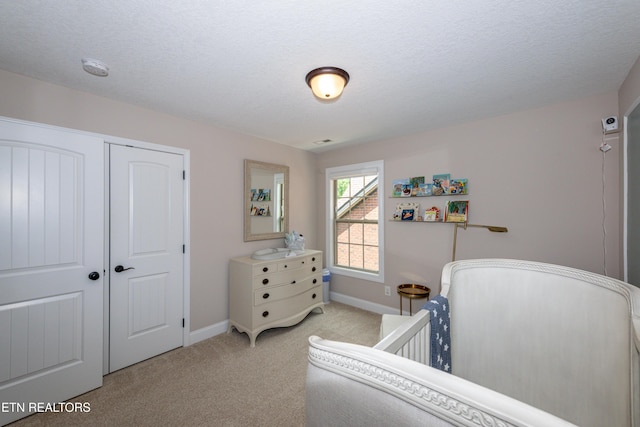 3336 Beaver Glade Ln, Knoxville, TN 37931 - bedroom featuring light carpet, baseboards, a closet, and a textured ceiling