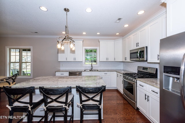 3336 Beaver Glade Ln, Knoxville, TN 37931 - kitchen with stainless steel appliances, a sink, white cabinets, backsplash, and recessed lighting