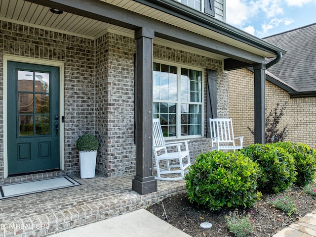 3336 Beaver Glade Ln, Knoxville, TN 37931 - doorway to property featuring covered porch and brick siding