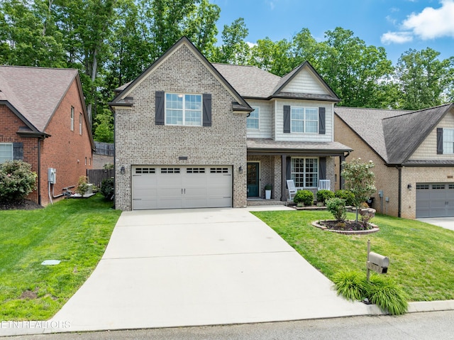 3336 Beaver Glade Ln, Knoxville, TN 37931 - view of front facade featuring a garage, concrete driveway, brick siding, a front lawn, and covered porch