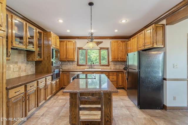 6605 Lammie Branch Ln, Knoxville, TN 37938 - kitchen featuring black appliances, a sink, recessed lighting, brown cabinetry, and decorative backsplash