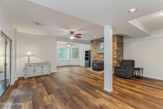 6605 Lammie Branch Ln, Knoxville, TN 37938 - unfurnished living room with a wood stove, dark wood-style floors, baseboards, a ceiling fan, and recessed lighting