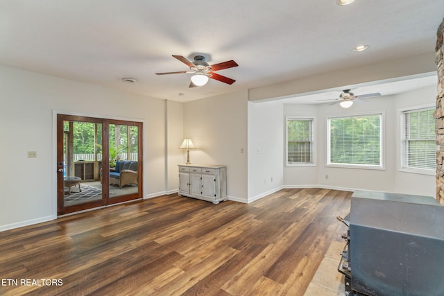 6605 Lammie Branch Ln, Knoxville, TN 37938 - unfurnished living room featuring a ceiling fan, wood finished floors, recessed lighting, baseboards, and a wood stove