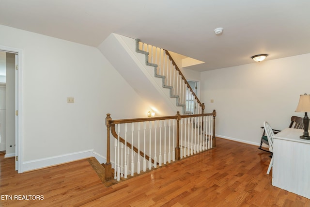 6605 Lammie Branch Ln, Knoxville, TN 37938 - corridor featuring an upstairs landing, wood finished floors, and baseboards