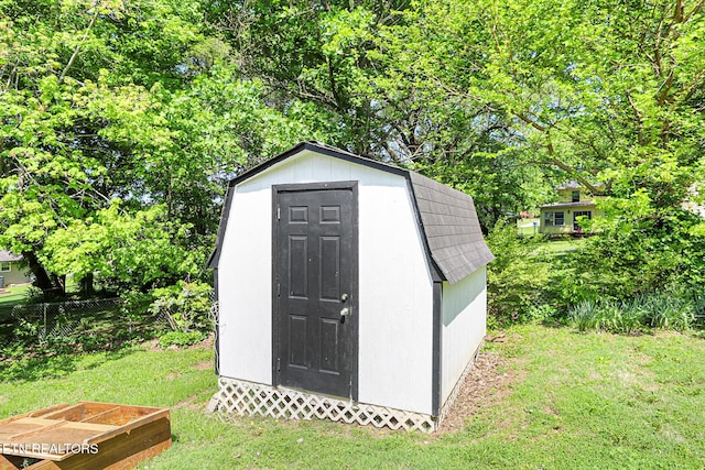view of shed with view of wooded area