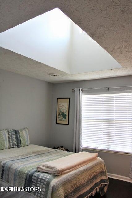 4808 Beverly Field Way, Knoxville, TN 37918 - bedroom featuring baseboards, dark wood finished floors, and visible vents