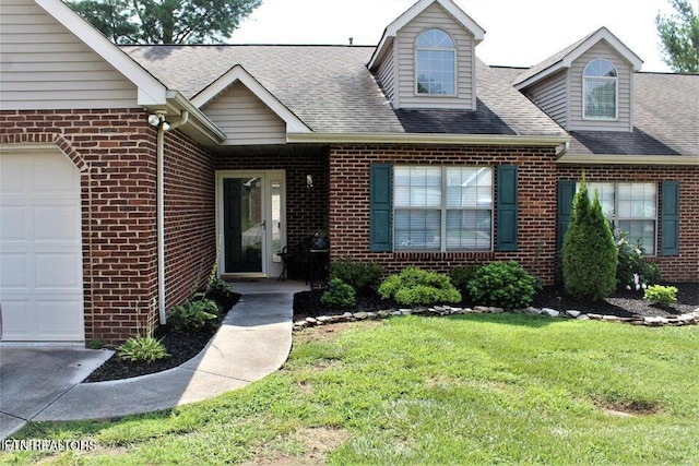4808 Beverly Field Way, Knoxville, TN 37918 - view of front of house with an attached garage, brick siding, roof with shingles, and a front yard