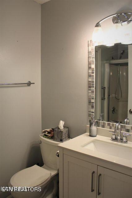 4808 Beverly Field Way, Knoxville, TN 37918 - bathroom featuring vanity, toilet, and an enclosed shower