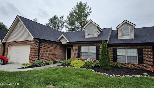 4808 Beverly Field Way, Knoxville, TN 37918 - cape cod house featuring brick siding, an attached garage, a front lawn, a shingled roof, and driveway