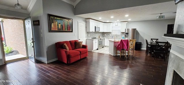 4808 Beverly Field Way, Knoxville, TN 37918 - living area featuring a fireplace, crown molding, hardwood / wood-style floors, baseboards, and recessed lighting