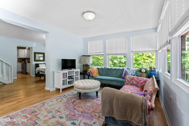 living area featuring wood finished floors and baseboards