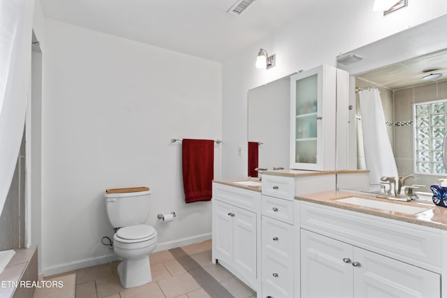full bath featuring tile patterned floors, toilet, double vanity, baseboards, and a shower with curtain