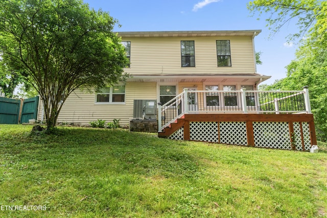 back of property with a wooden deck and stairway