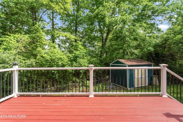 deck featuring a storage shed and an outbuilding