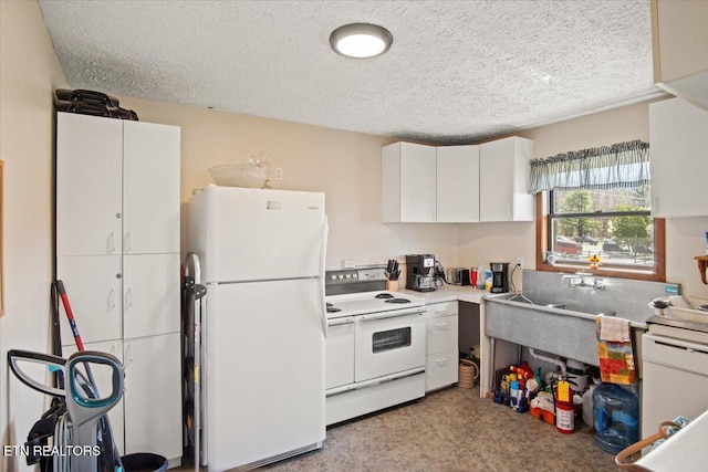 kitchen featuring white appliances, white cabinetry, a textured ceiling, and light countertops