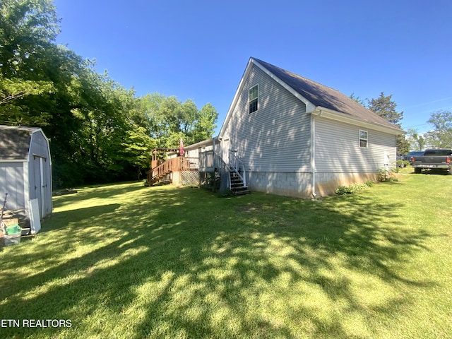 205 Browder Rd, Kingston, TN 37763 - view of property exterior featuring a wooden deck, a lawn, a storage unit, and stairs