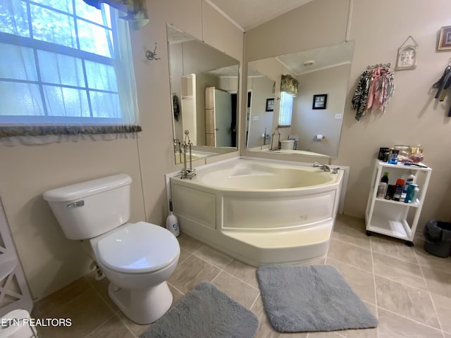 205 Browder Rd, Kingston, TN 37763 - bathroom featuring a garden tub, toilet, tile patterned flooring, and ornamental molding