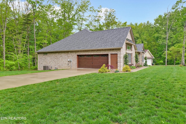 view of property exterior featuring brick siding, cooling unit, a shingled roof, an attached garage, and a yard