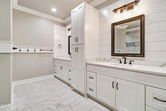 full bath with marble look tiles, vanity, recessed lighting, and baseboards