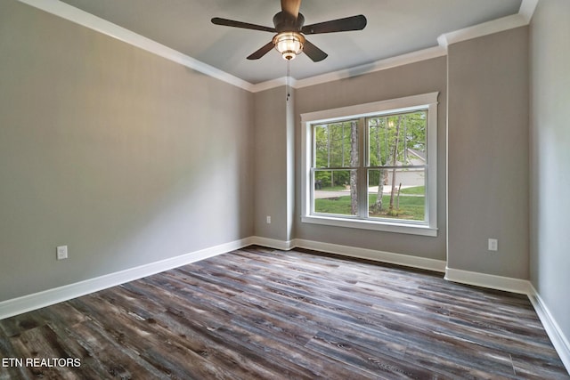 unfurnished room with a ceiling fan, dark wood-style floors, crown molding, and baseboards